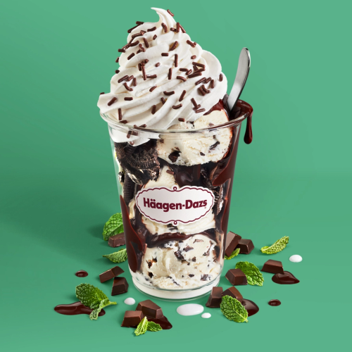 Mint Chip Dazzler Mint chip ice cream layered with hot fudge and chocolate cookie pieces topped with whipped cream and chocolate sprinkles. Served with toppings.